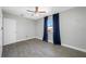 Comfortable bedroom with wood-look floors, large window, and soft, natural light at 3310 W Swann Ave, Tampa, FL 33609
