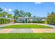 Charming single-story home with a well-manicured lawn, lovely landscaping, and a cozy feel at 3310 W Swann Ave, Tampa, FL 33609