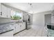 Well-lit kitchen with stainless steel refrigerator and modern appliances at 3310 W Swann Ave, Tampa, FL 33609
