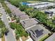 The aerial view reveals the home's roof, surrounding trees, and neighborhood at 405 Laguna Mill Dr, Ruskin, FL 33570