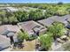 A peaceful residential neighborhood with mature trees surrounding a cozy single-Gathering home at 405 Laguna Mill Dr, Ruskin, FL 33570