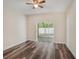 Spacious bedroom with sliding glass doors leading to an outdoor patio at 405 Laguna Mill Dr, Ruskin, FL 33570