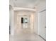 Bright foyer with tile flooring, arched doorways, and ample natural light throughout at 405 Laguna Mill Dr, Ruskin, FL 33570