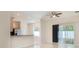 Bright and airy living space with tile flooring, neutral decor, and lots of natural light at 405 Laguna Mill Dr, Ruskin, FL 33570