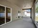 Screened lanai with slider access to the home's interior and view of the fenced backyard at 405 Laguna Mill Dr, Ruskin, FL 33570