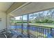 Enjoy serene pond views from this covered balcony, perfect for relaxation at 5019 Mill Pond Rd # 3128, Wesley Chapel, FL 33543