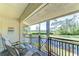 Enjoy this covered balcony overlooking a tranquil pond and green space at 5019 Mill Pond Rd # 3128, Wesley Chapel, FL 33543