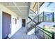 Covered exterior walkway with steps leading to upper levels at 5019 Mill Pond Rd # 3128, Wesley Chapel, FL 33543