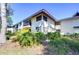 Well-maintained condo building with lush landscaping and balconies in a serene setting at 5019 Mill Pond Rd # 3128, Wesley Chapel, FL 33543