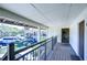 View from condo exterior with deck and railing overlooking the property at 5019 Mill Pond Rd # 3128, Wesley Chapel, FL 33543