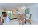 Bright living room featuring stylish decor, comfortable seating, and access to an outdoor balcony at 5019 Mill Pond Rd # 3128, Wesley Chapel, FL 33543