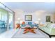 Comfortable living room with balcony access, bright lighting, and stylish decor at 5019 Mill Pond Rd # 3128, Wesley Chapel, FL 33543