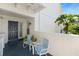 Inviting front porch with seating, a black front door, and views of tropical plants at 5203 Bayshore Blvd # 10, Tampa, FL 33611