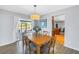 Dining room showcasing a wooden table, light fixture, and an open view to the kitchen and canal at 5208 Denver Ne St, St Petersburg, FL 33703