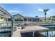 Private dock with stairs leading to a screened patio, pool, and beautiful backyard at 5208 Denver Ne St, St Petersburg, FL 33703