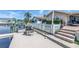 Private dock leads to a beautifully landscaped backyard and a sparkling pool at 5208 Denver Ne St, St Petersburg, FL 33703