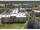 Aerial view of the complex with a pool, tennis courts, and lush landscaping at 5820 N Church Ave # 148, Tampa, FL 33614