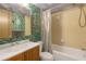 Cozy bathroom with tub/shower combination and unique wallpaper at 5820 N Church Ave # 148, Tampa, FL 33614