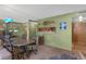 A living room featuring carpet, natural light and mirrors at 5820 N Church Ave # 148, Tampa, FL 33614