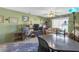 A living room featuring carpet, natural light and a desk at 5820 N Church Ave # 148, Tampa, FL 33614