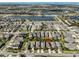 Aerial view of a neighborhood with lakes and community amenities, with a red marker indicating the property at 6338 Springline Pl, Apollo Beach, FL 33572