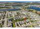 Aerial view of a neighborhood with lakes and community amenities, with a red marker indicating the property at 6338 Springline Pl, Apollo Beach, FL 33572