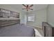 Bedroom features a decorative ceiling fan and a large painting above the bed at 6338 Springline Pl, Apollo Beach, FL 33572