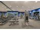 Well-equipped gym with various machines, weights, and mirrors, offering a great workout space at 6338 Springline Pl, Apollo Beach, FL 33572