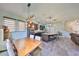Open kitchen and dining area with stainless steel appliances, large center island, and a cozy dining table at 6338 Springline Pl, Apollo Beach, FL 33572