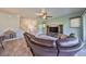 Comfortable living room featuring tile floors, a ceiling fan, and a cozy space under the stairs at 6338 Springline Pl, Apollo Beach, FL 33572