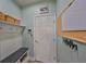 Convenient mud room with bench, storage, and hooks near the entrance at 6338 Springline Pl, Apollo Beach, FL 33572