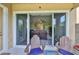 Patio view looking into the living room through sliding glass doors and outdoor seating at 6338 Springline Pl, Apollo Beach, FL 33572