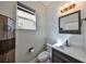 Chic powder room with shiplap walls, wooden accents, and modern fixtures at 6338 Springline Pl, Apollo Beach, FL 33572