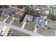 Aerial view of a single-Gathering home featuring a driveway, landscaping, and a fenced backyard at 6527 Grapewood Rd, Spring Hill, FL 34609
