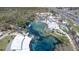 Aerial view of a clear blue water park with slides and leisure facilities at 6527 Grapewood Rd, Spring Hill, FL 34609