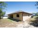 The home's exterior features a cozy patio, a well-maintained lawn, and access to backyard at 6527 Grapewood Rd, Spring Hill, FL 34609