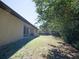 Spacious backyard with lawn and trees, perfect for outdoor activities and relaxation at 6527 Grapewood Rd, Spring Hill, FL 34609