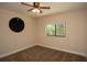 Bedroom featuring carpet flooring, neutral paint, ceiling fan and a window offering natural light at 6527 Grapewood Rd, Spring Hill, FL 34609