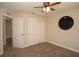 Bedroom featuring carpet flooring, neutral paint, ceiling fan, closet and a window offering natural light at 6527 Grapewood Rd, Spring Hill, FL 34609