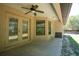 Covered patio with ceiling fan, ideal for outdoor entertaining and relaxing at 6527 Grapewood Rd, Spring Hill, FL 34609