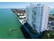 Waterfront condo building featuring a bayside swimming pool and dock with stunning views at 7200 Sunshine Skyway S Ln # 16G, St Petersburg, FL 33711