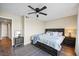 Comfortable bedroom with a ceiling fan, nightstands, and neutral decor at 7200 Sunshine Skyway S Ln # 16G, St Petersburg, FL 33711