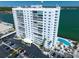An exterior view of the building, highlighting the architecture and surrounding landscape at 7200 Sunshine Skyway S Ln # 16G, St Petersburg, FL 33711