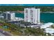 Exterior of the building showcasing balconies, parking, and beach access at 7200 Sunshine Skyway S Ln # 16G, St Petersburg, FL 33711