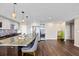 Modern kitchen with stone countertops, stainless steel appliances, and center island with pendant lighting at 7200 Sunshine Skyway S Ln # 16G, St Petersburg, FL 33711
