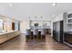 Modern kitchen featuring a large island with bar stools, stainless appliances, and open concept layout at 7200 Sunshine Skyway S Ln # 16G, St Petersburg, FL 33711