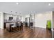 Modern kitchen with stainless steel appliances, an island and hardwood floors at 7200 Sunshine Skyway S Ln # 16G, St Petersburg, FL 33711