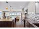 Bright kitchen featuring sleek cabinetry, modern appliances, and an eat-in island overlooking the water at 7200 Sunshine Skyway S Ln # 16G, St Petersburg, FL 33711