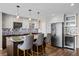 Kitchen featuring stainless steel appliances, modern cabinets, mosaic backsplash, and a wine refrigerator at 7200 Sunshine Skyway S Ln # 16G, St Petersburg, FL 33711