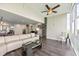 Comfortable living room with floor-to-ceiling windows and view of adjoining modern kitchen at 7200 Sunshine Skyway S Ln # 16G, St Petersburg, FL 33711